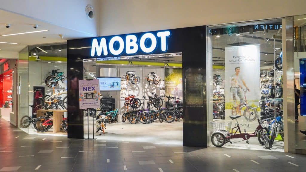 MOBOT @ NEX Outlet Frontal View of Store with CAMP Gold NDP Display and Trimax Tricycle