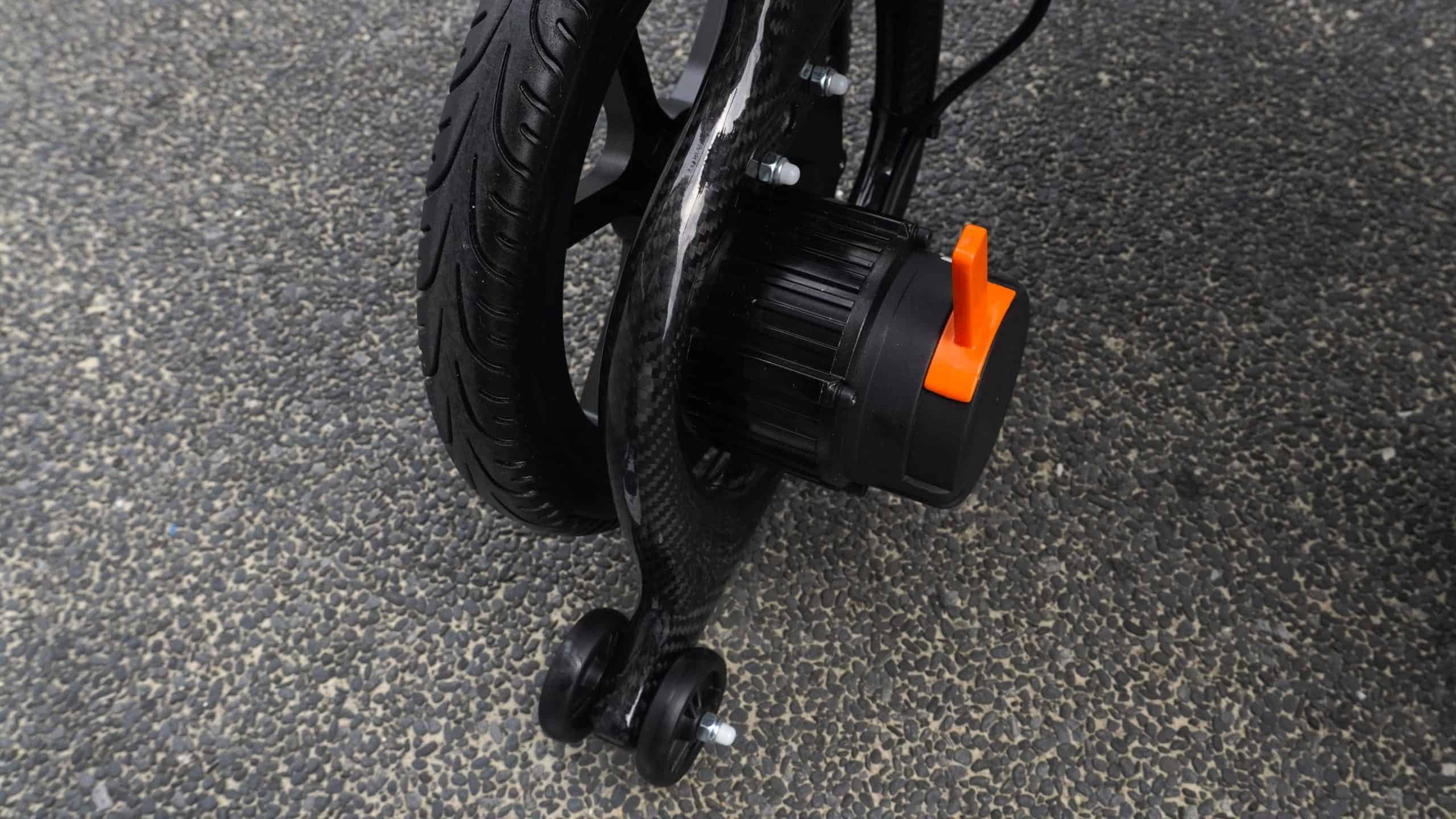 mwheel carbon rs motor and tipping wheel scaled - Press Release: Comparing the MWHEEL RS & Carbon RS – MOBOT’s Premiere Motorised Electric Wheelchairs for Effortless Mobility